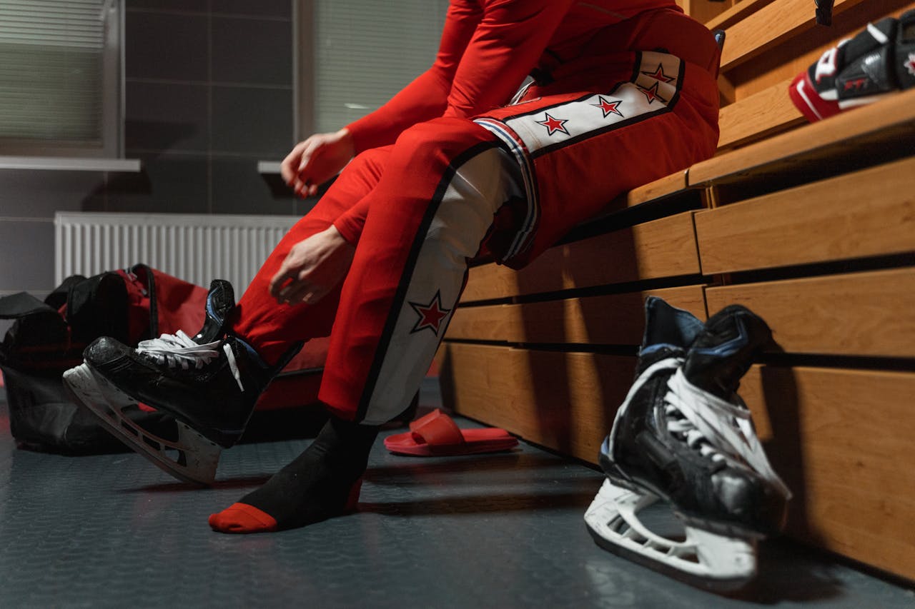 guy taking off hockey skates