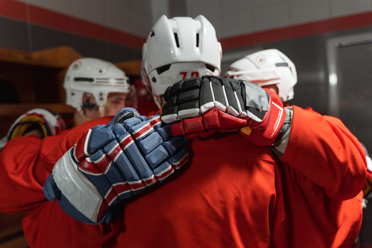kids wearing hockey helmet and gloves