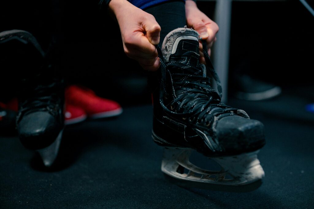 guy trying on hockey skates
